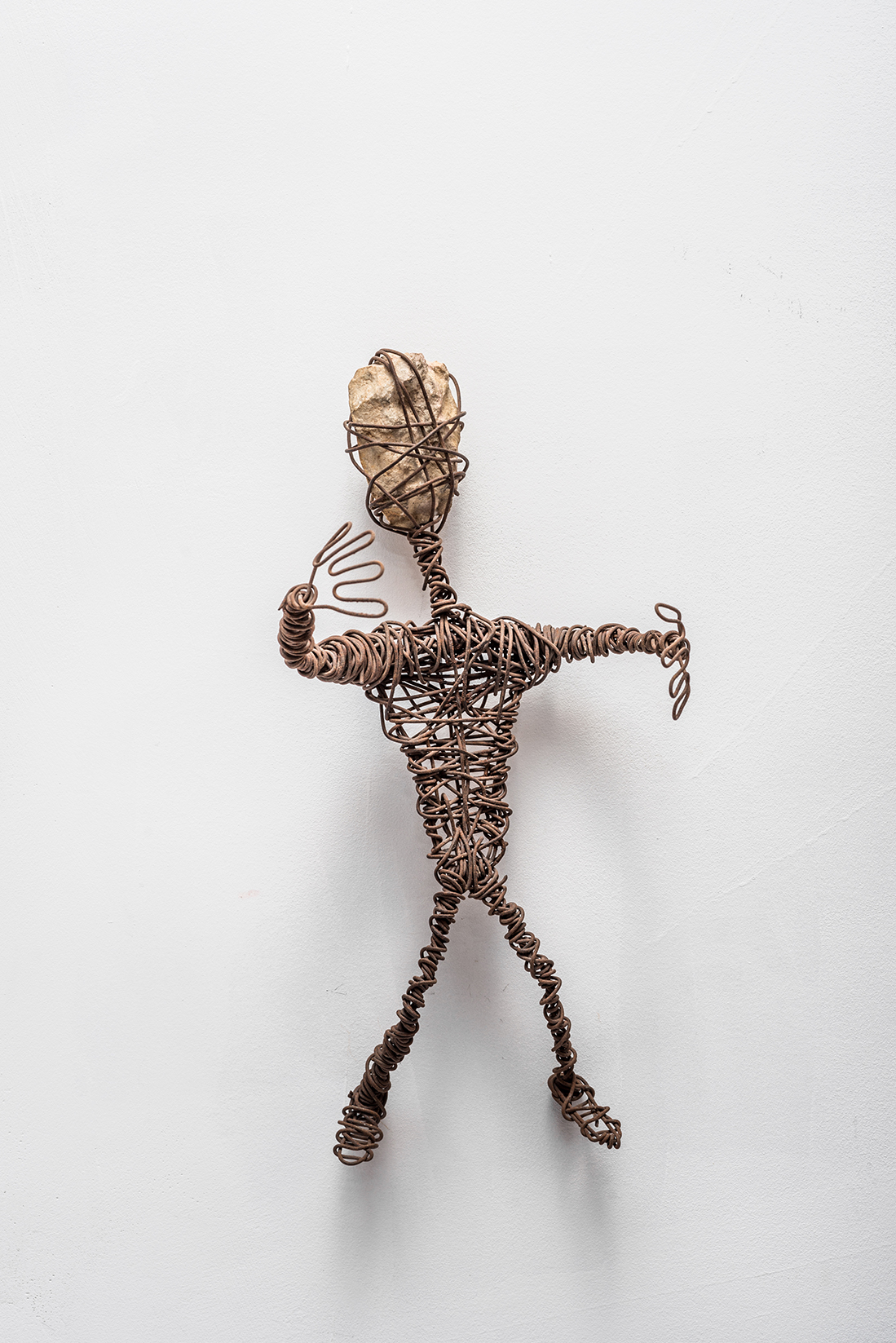 From the Outcasts series, manually bent wire, 28 x 16 x 12 cm, metal wire and stone, 2004 Photo: Lior Horesh