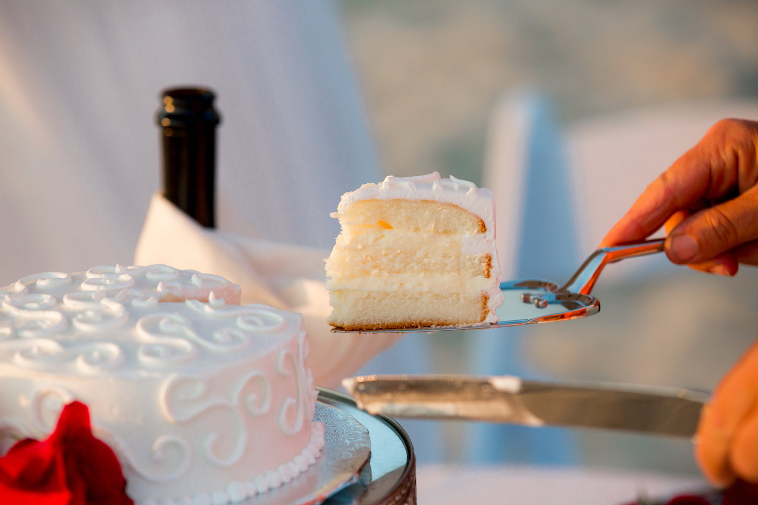 slice of wedding cake at beach elopement