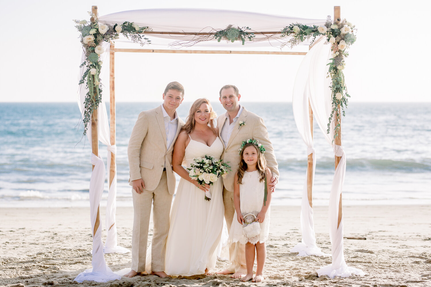 family wedding photos under chuppah on Santa Barbara beach