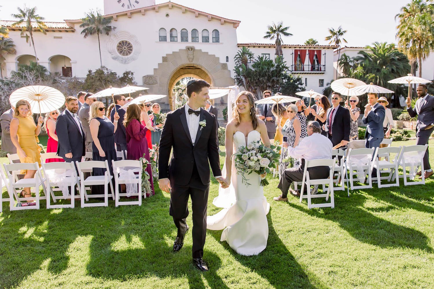  bride and groom walk down aisle at Santa Barbara Courthouse 