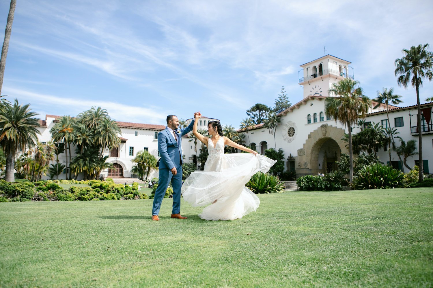  bride and groom dancing in front of Santa Barbara Courthouse 