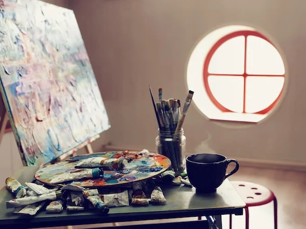 Art studio closeup of brushes and palette