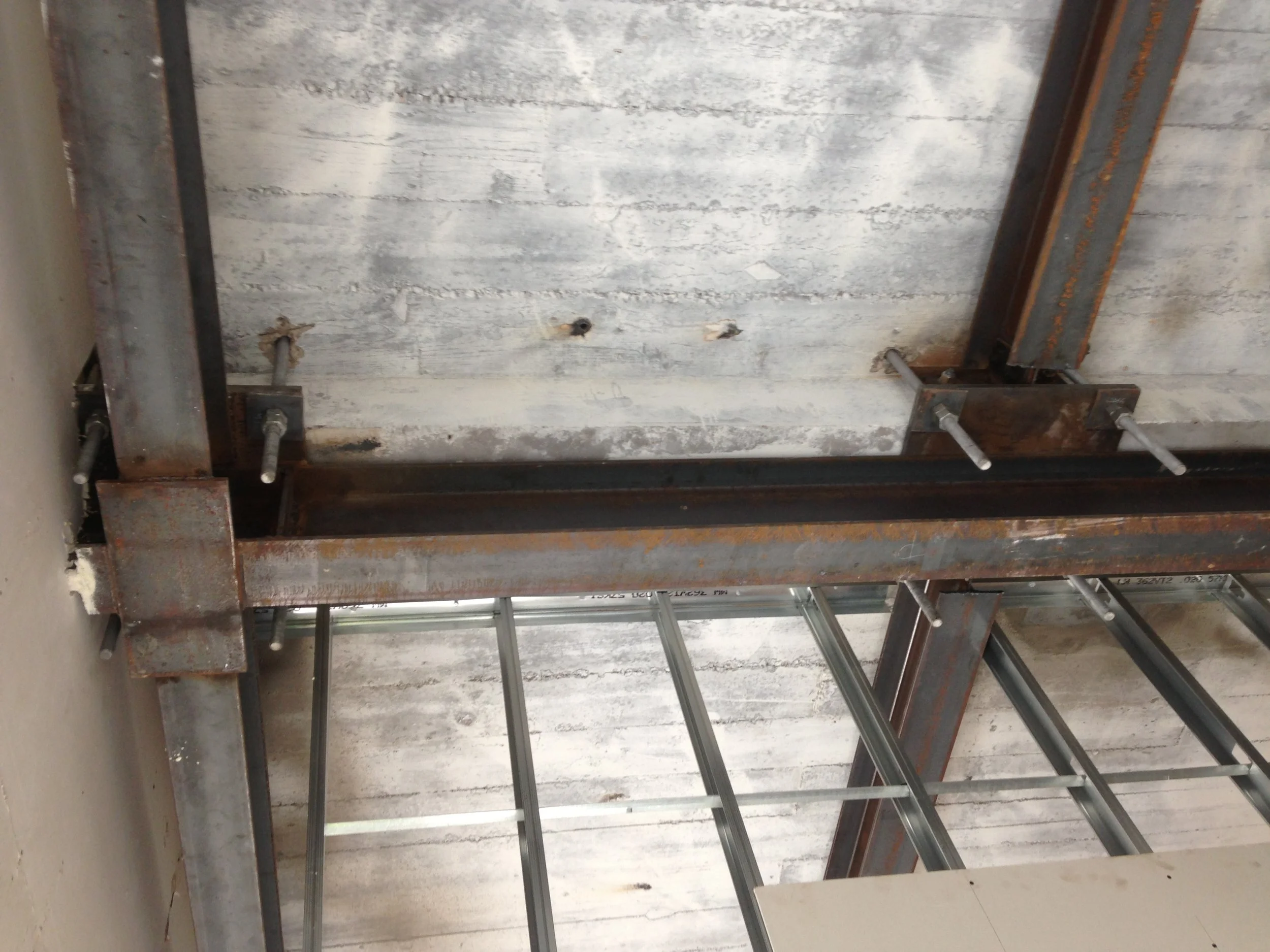 Step 5. With the threaded rods welded in place, the nuts were torqued to the engineer’s specifications. Both Pedestals and Tie-backs appear taller than necessary because of the added thickness of the roofing and insulation that will be installed above the slab.