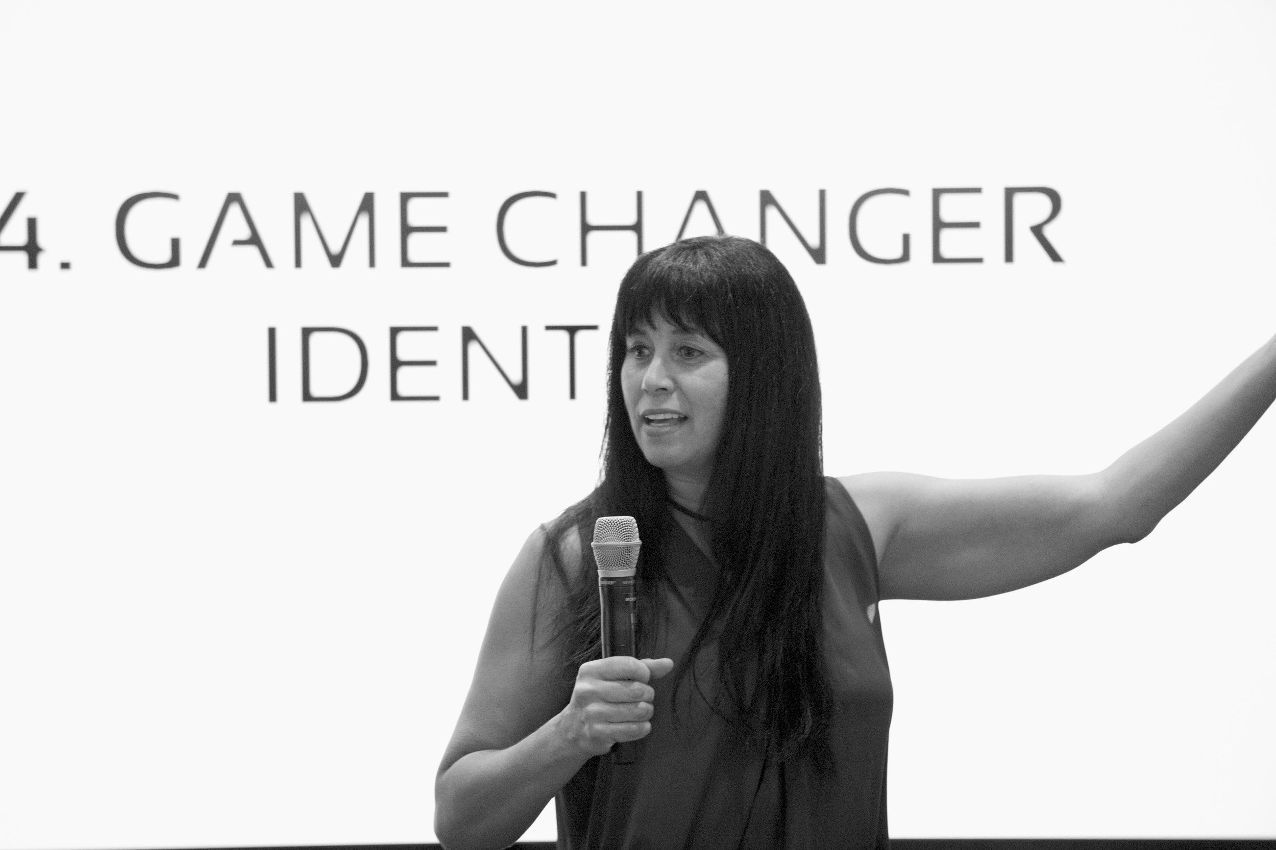 Gina speaking with mic B&W.jpg