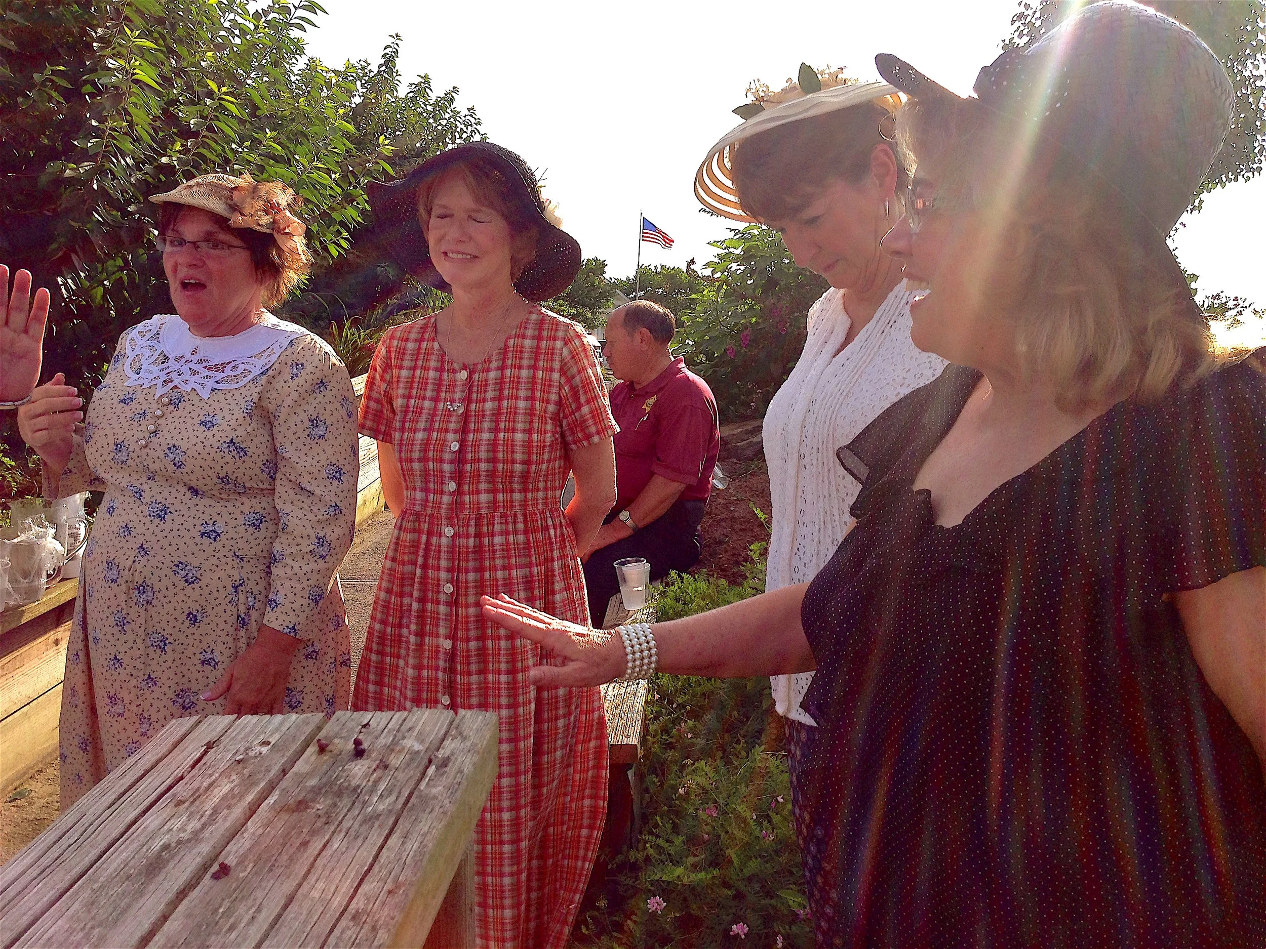 Tina Bolton-Kilgore, Danese Ball, Teresa Buckner and Susan Blazer Burgin wait for the cameras to start rolling in Newport's Serenity Garden on Day 18 of the tour. 