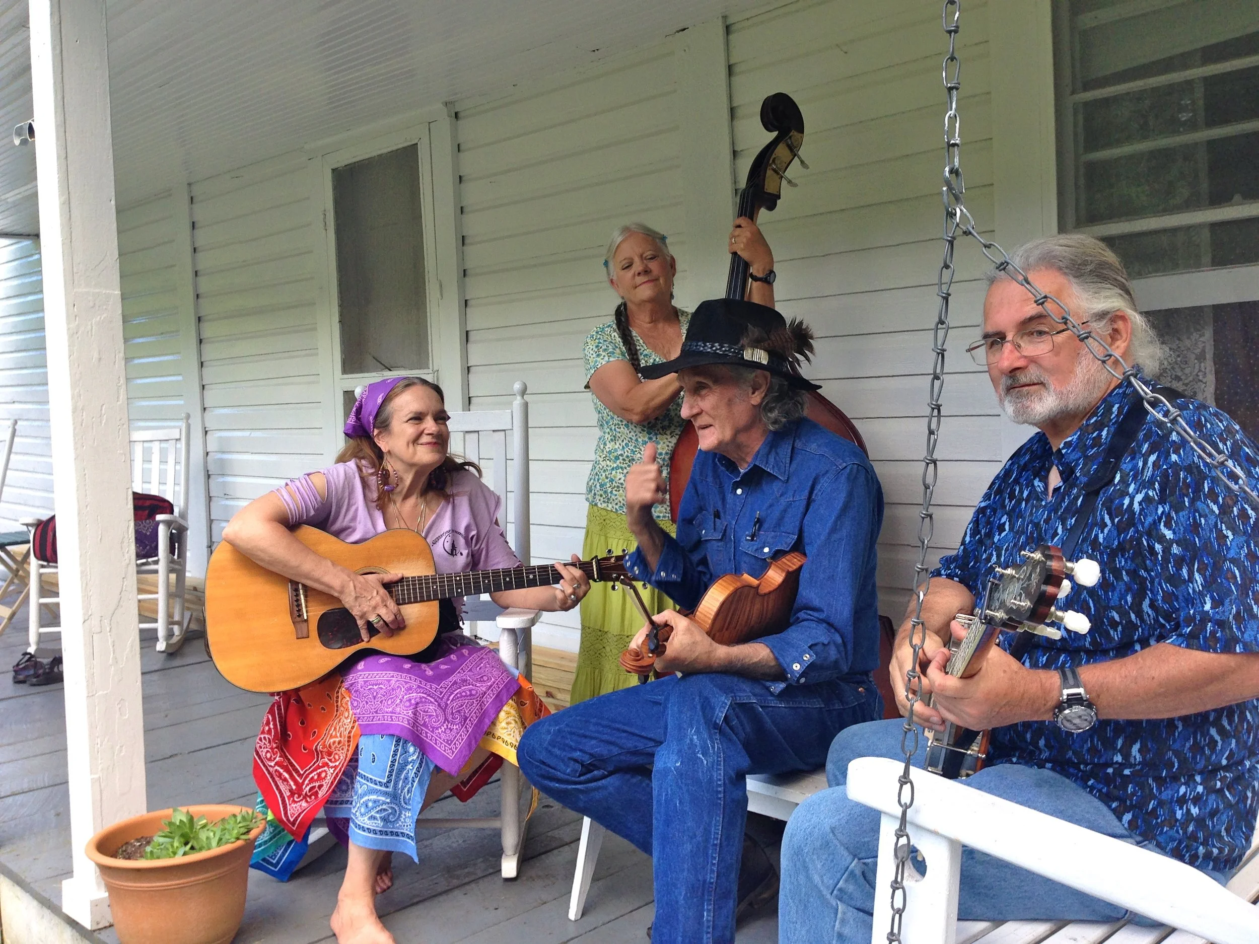 Day 17 closed with a performance of two old-time classics by T.V. Barnett and His Roan Mountain Moonshiners (L to R, Rhodyjane Meadows, Sam Jones, T.V. Barnett and Michael Jones) on the porch of the 19th century Miller Homestead, inside Roan Mountain State Park.