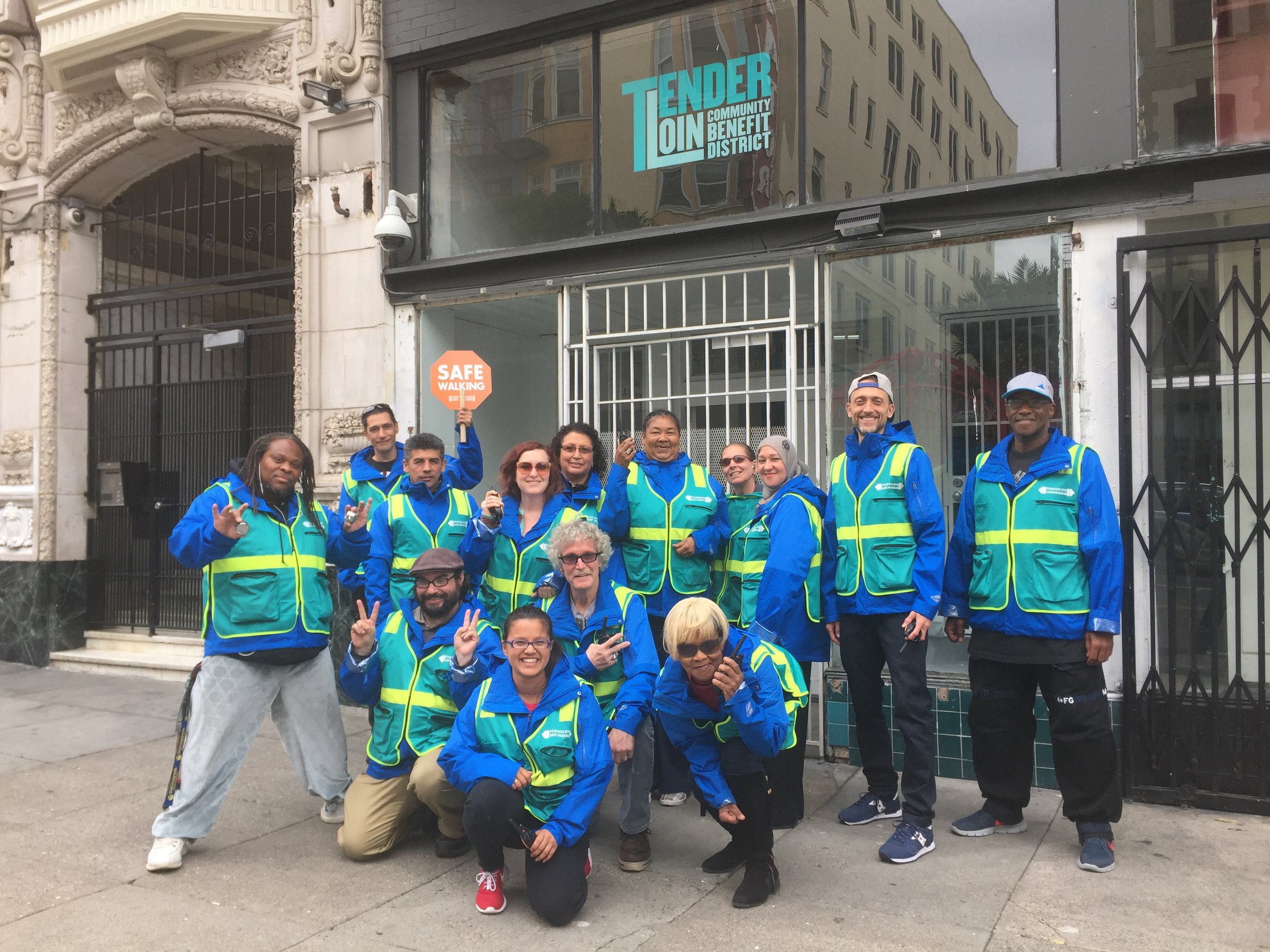 Safe Passage Corner Captains pose in front of TLCBD office at 512 Ellis Street.