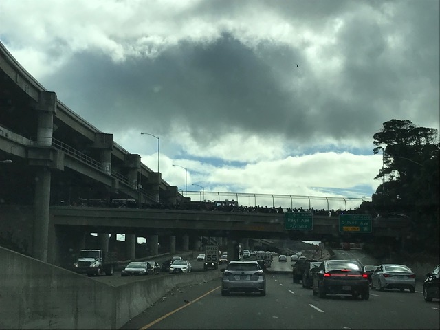 SFPD officers lined an overpass to salute Officer Elia as he travelled south to transfer from SF General to a brain injury Santa Clara Valley Medical Center brain injury unit. Photo courtesy of Team Elia.