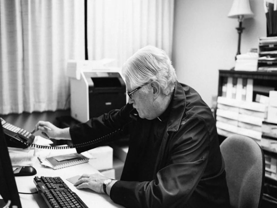 Night Minister The Rev. Lyle Beckman answers the ministry's crisis line. Photo courtesy of filmmaker James Hosking