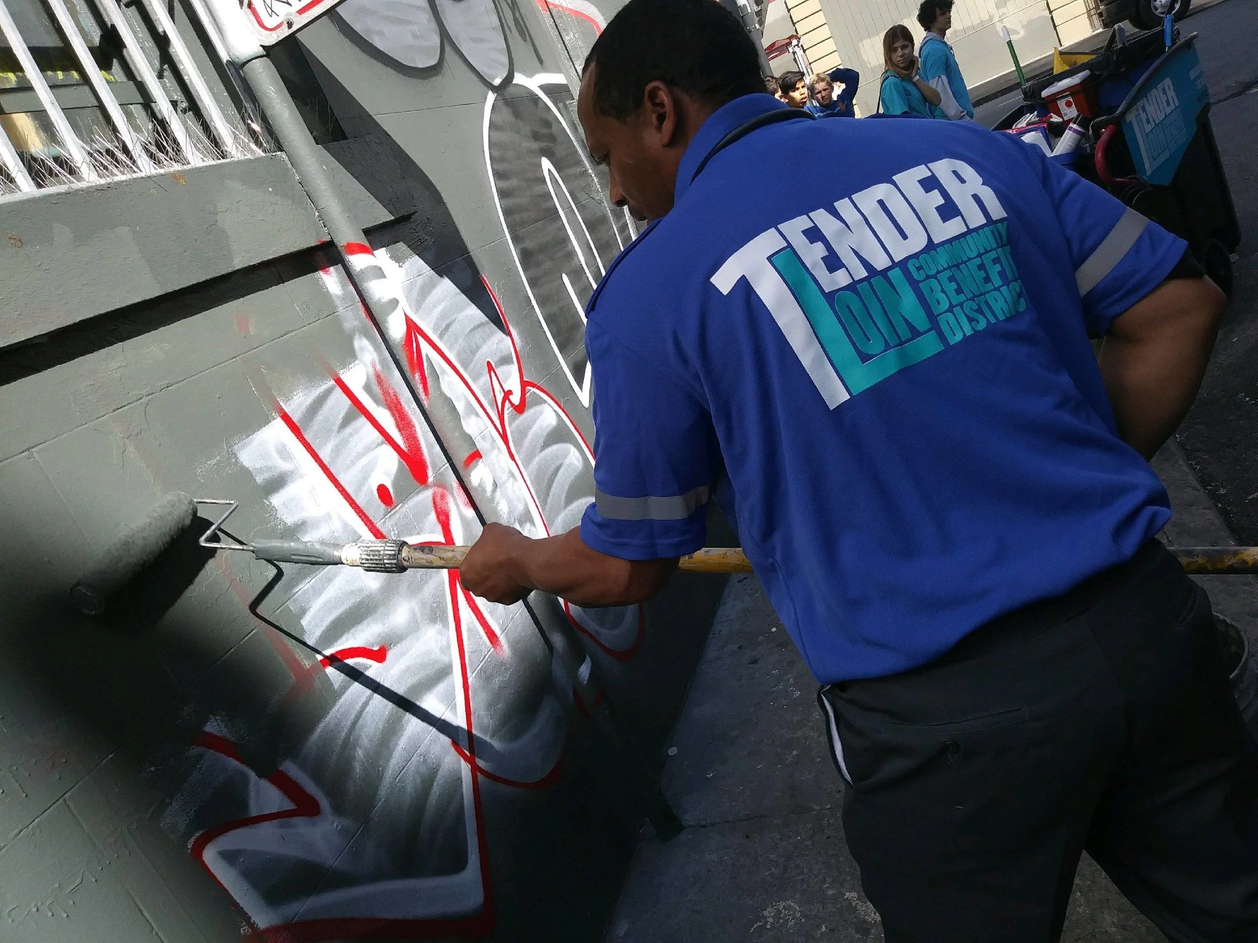Clean Team remove graffiti from a building on Turk Street.