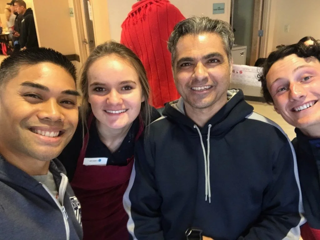 Lexx alongside student volunteers from St. Ignatius High School