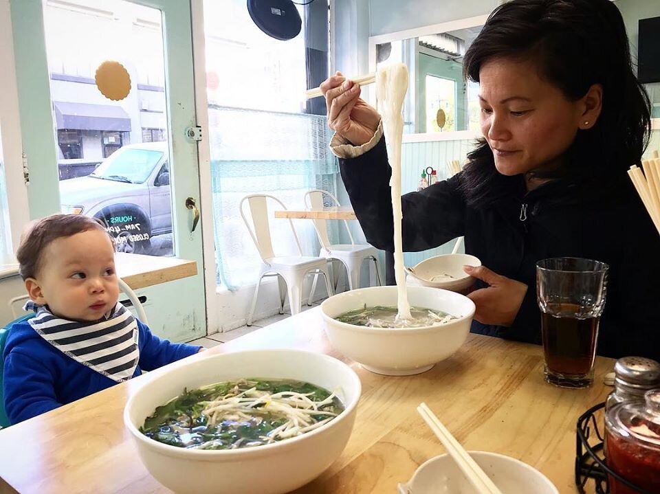 Linh with her son, Lincoln eating lunch at Mong Thu