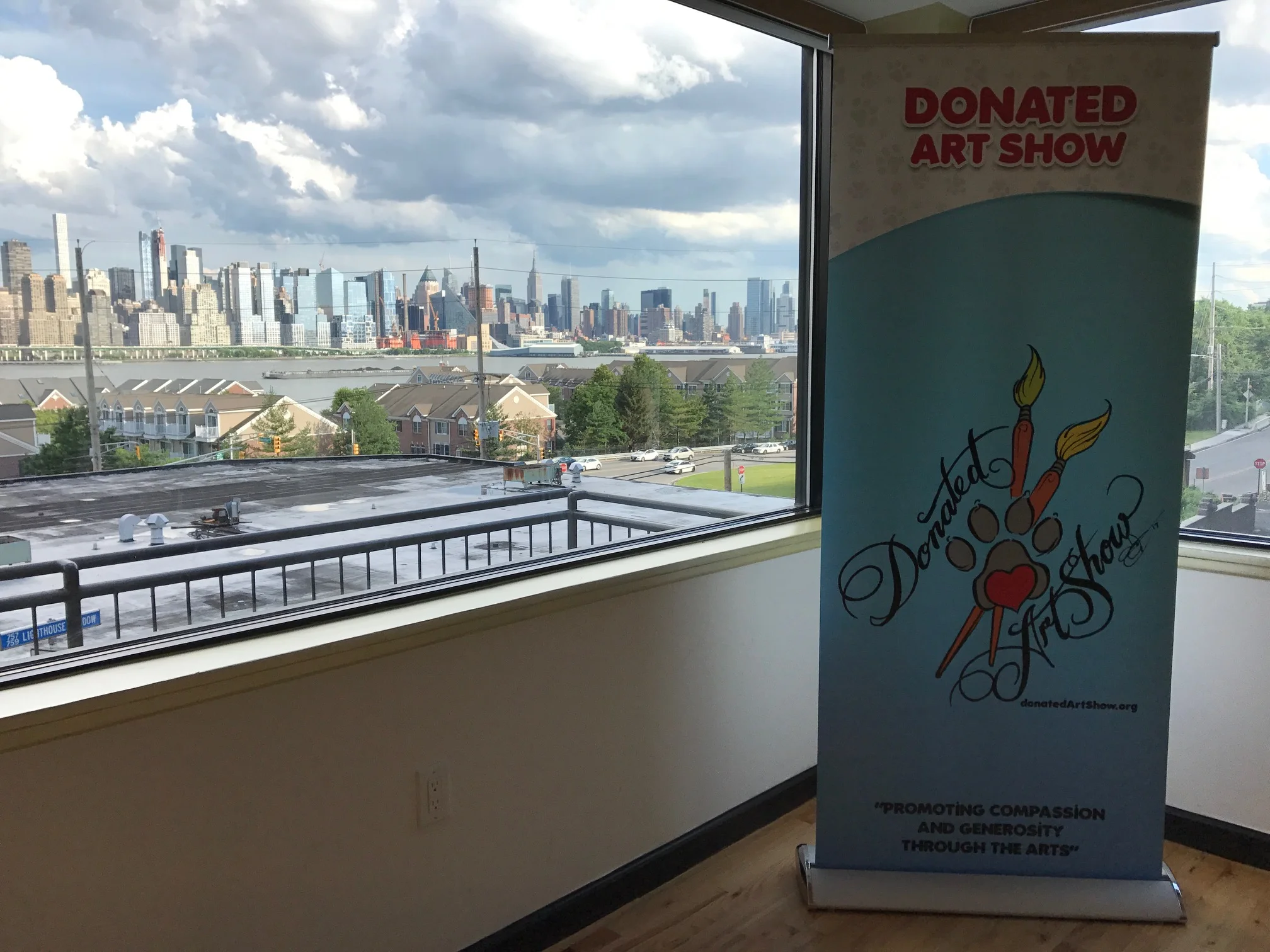  Donated Art Show banner with the New York City skyline.&nbsp; 