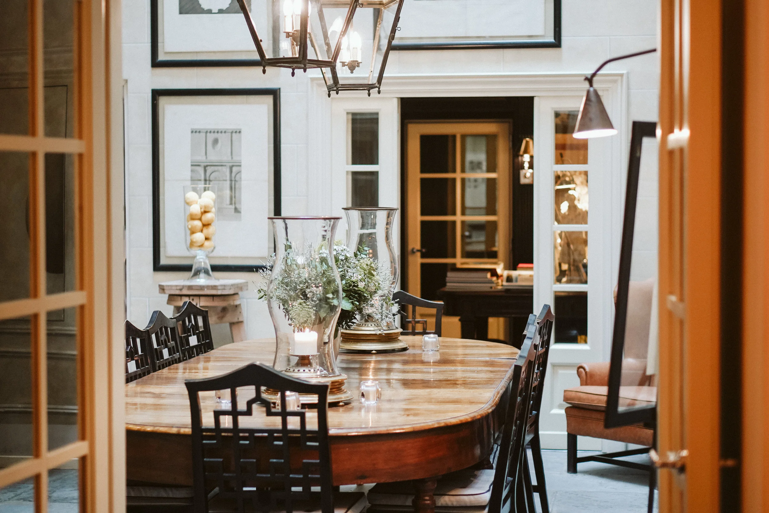 The breakfast room is paved with grey sandstone of the original building. A large unique walnut table and Latterns in copper are all from the 1800s. Chinese style chairs are designed by Michele Bonan.