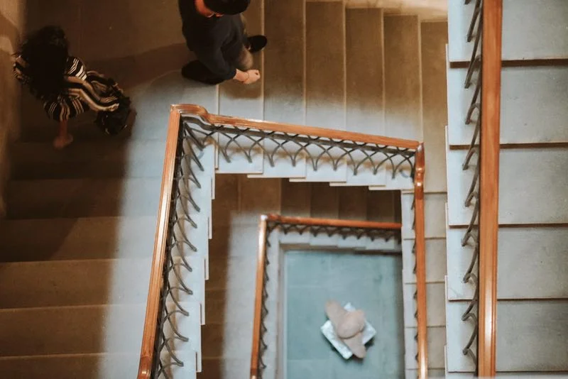 Grey sand stone is used for the wide, airy stairway in neoclassical taste.