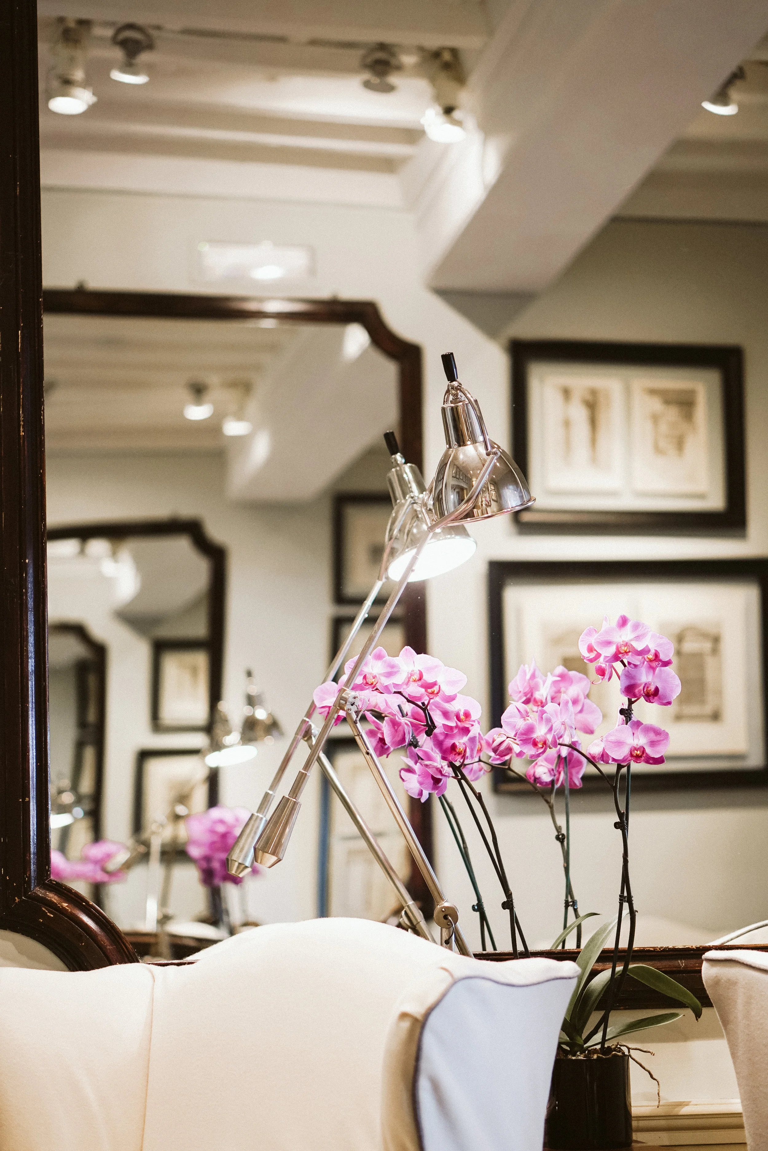 The walls are hung with huge mirrors, drawings and engraving.