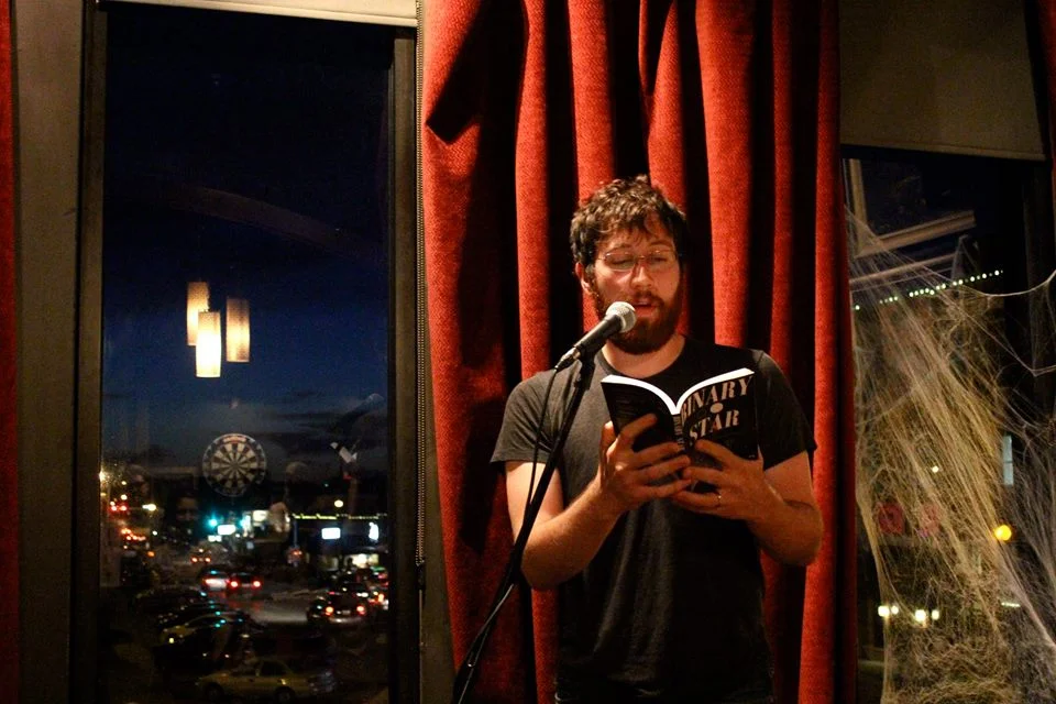 Colin at a reading in Denton c. 2014 | photo by courtney marie