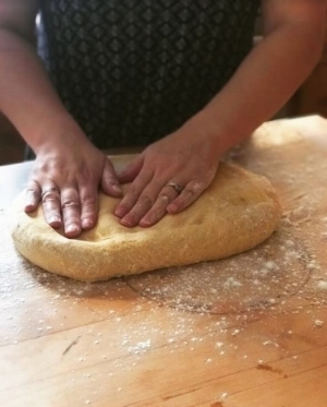 Caitlin works her magic on the dough.