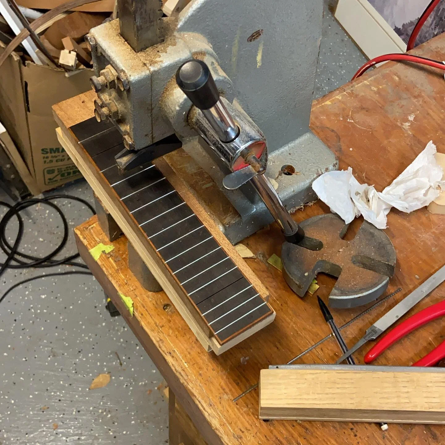 Installing frets on the guilele fretboard. It&rsquo;s tedious and time consuming work but worth taking the time to do it right #guitar #guitarbuilding #luthier #napa @angeloguitarco