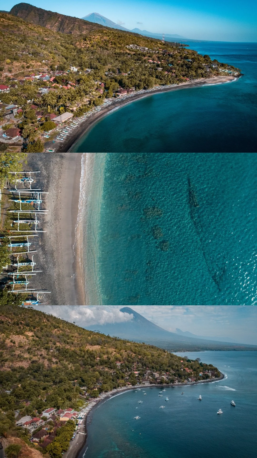 Aerial view of a coastal area with a beach, boats on the water, and lush green hills with Mount Agung in the background, likely in Bali, Indonesia.
