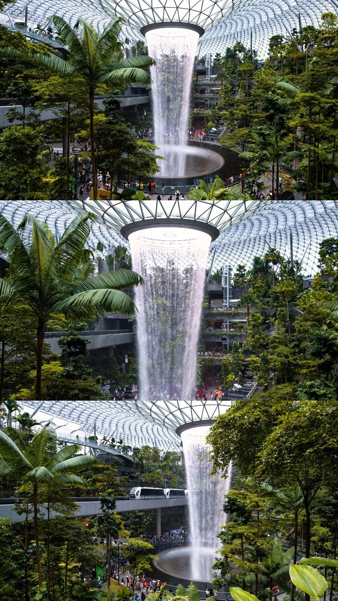 Indoor garden with a large window waterfall and a glass-domed ceiling.