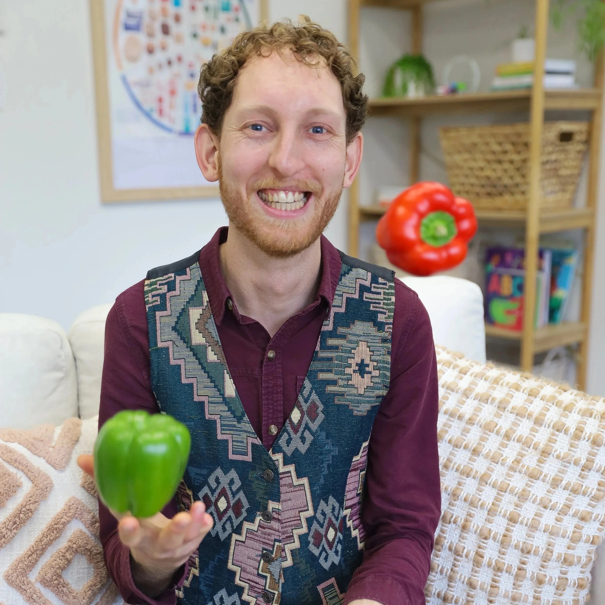 Dietitian Casey Webb juggling coloured capsicums