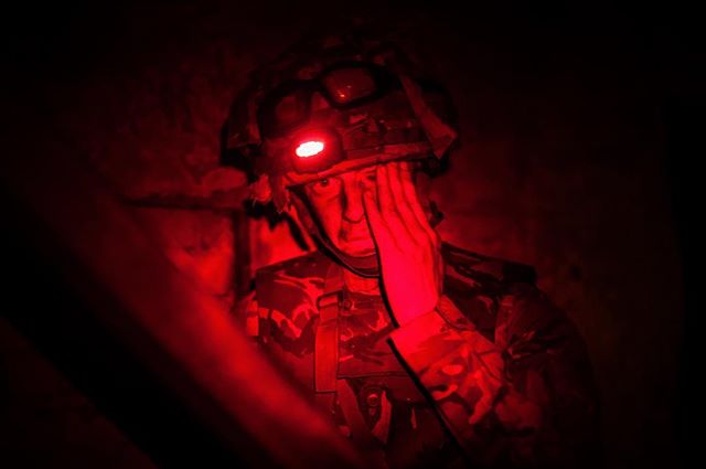 He's clearly enjoying himself #army #training #soldier #redlight #night #tired #documentary #photojournalism #photography #photograph #visualsoflife #moments #film #filmmaker #publishing