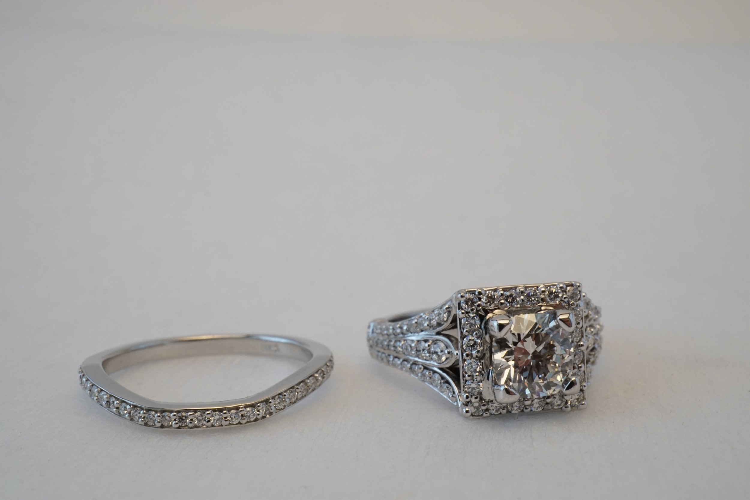  This piece they searched for the right cushion cut center diamond, and then picked out the engagement ring and wedding band as stock bands. I then set all the stones and did the finishing touches on this ring. 
