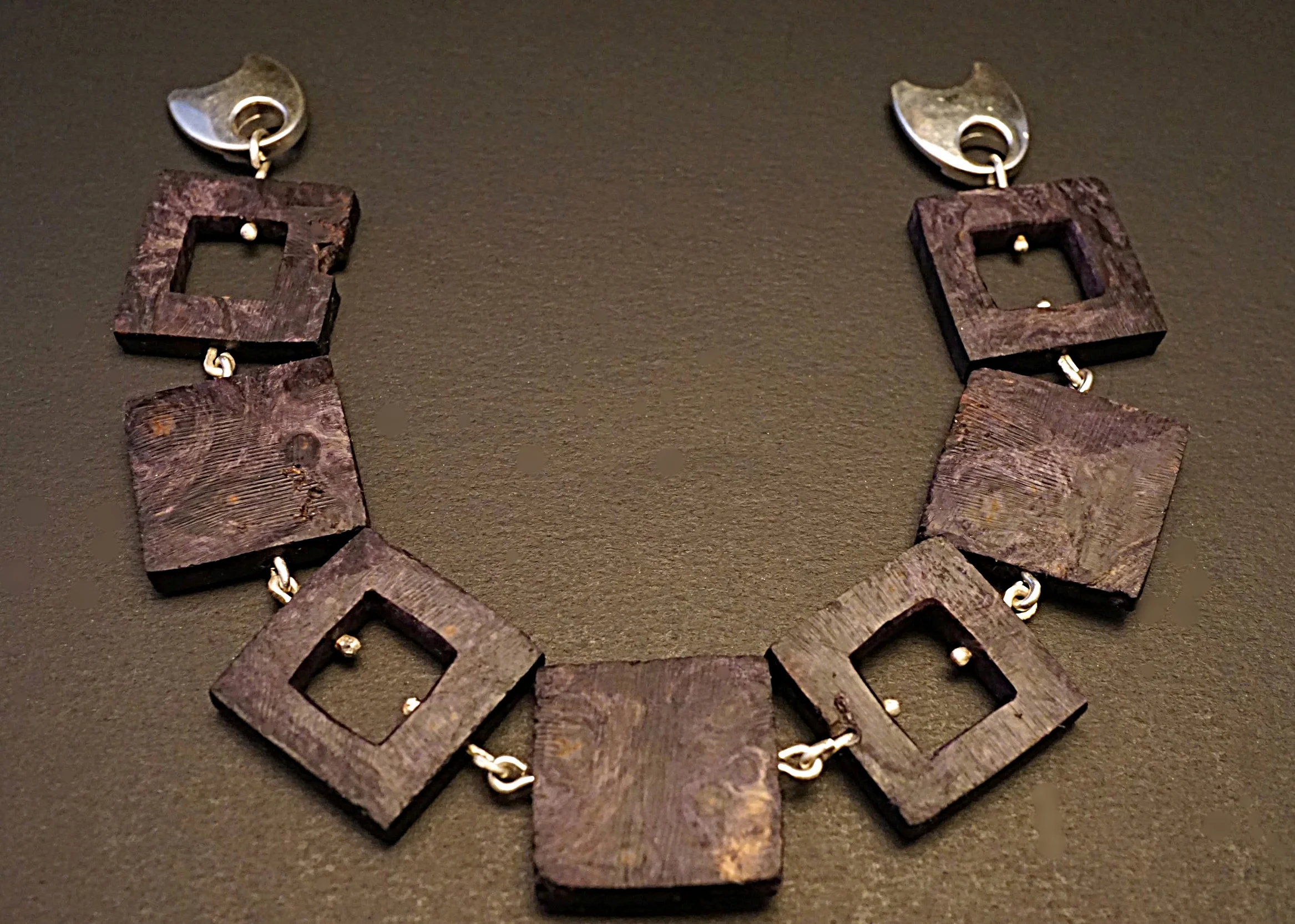 Hand carved buckeye burl links with sterling silver connectors and sterling silver magnetic clasp