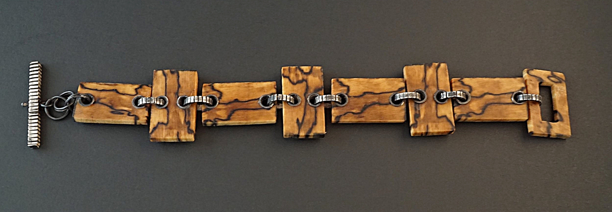Hand carved spalted hackberry wood links with sterling silver textured connectors and toggle