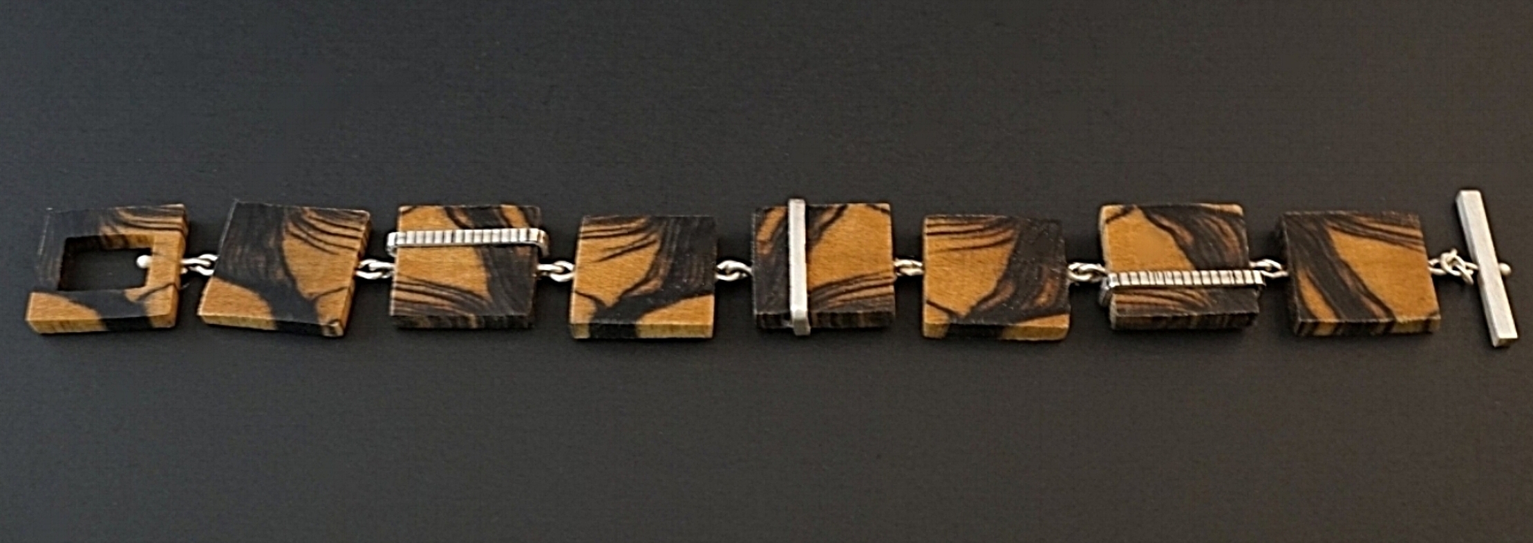 Black and white ebony hand carved bracelet with sterling silver