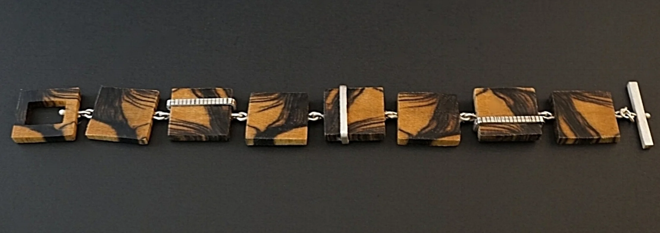 Black and white ebony hand carved bracelet with sterling silver