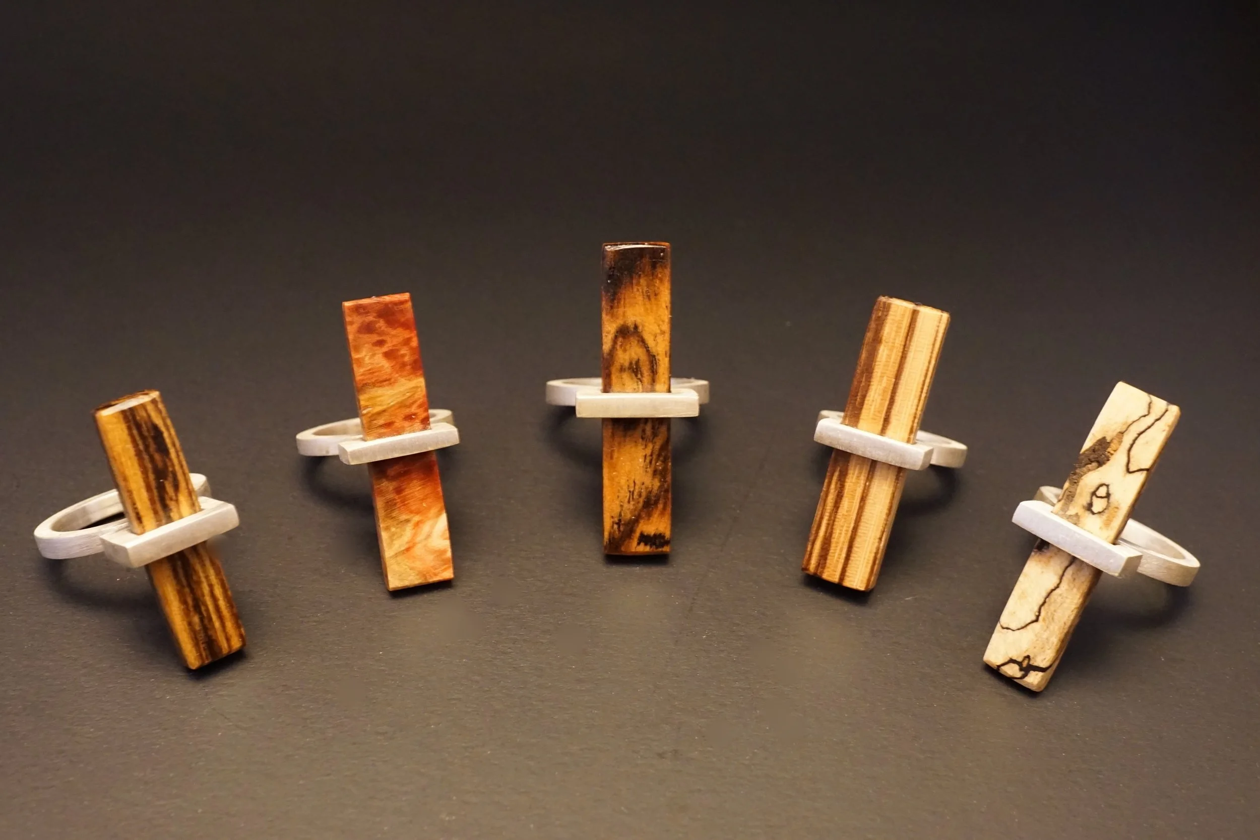 Shimmering Carbon mixes exotic wood with a fabricated sterling silver ring.