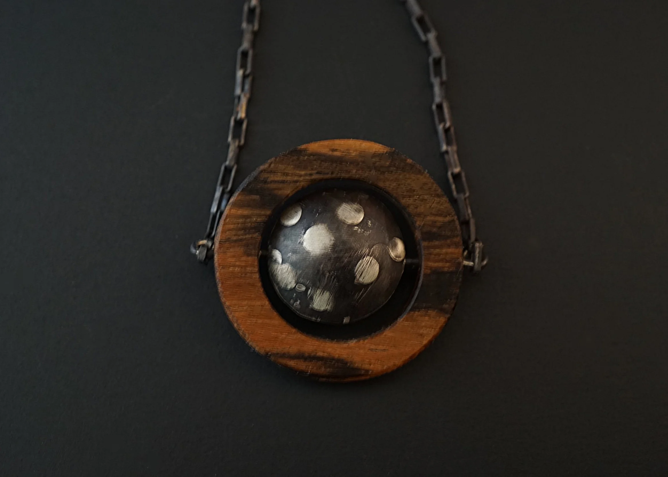 Domed sterling silver bocote wood pendant