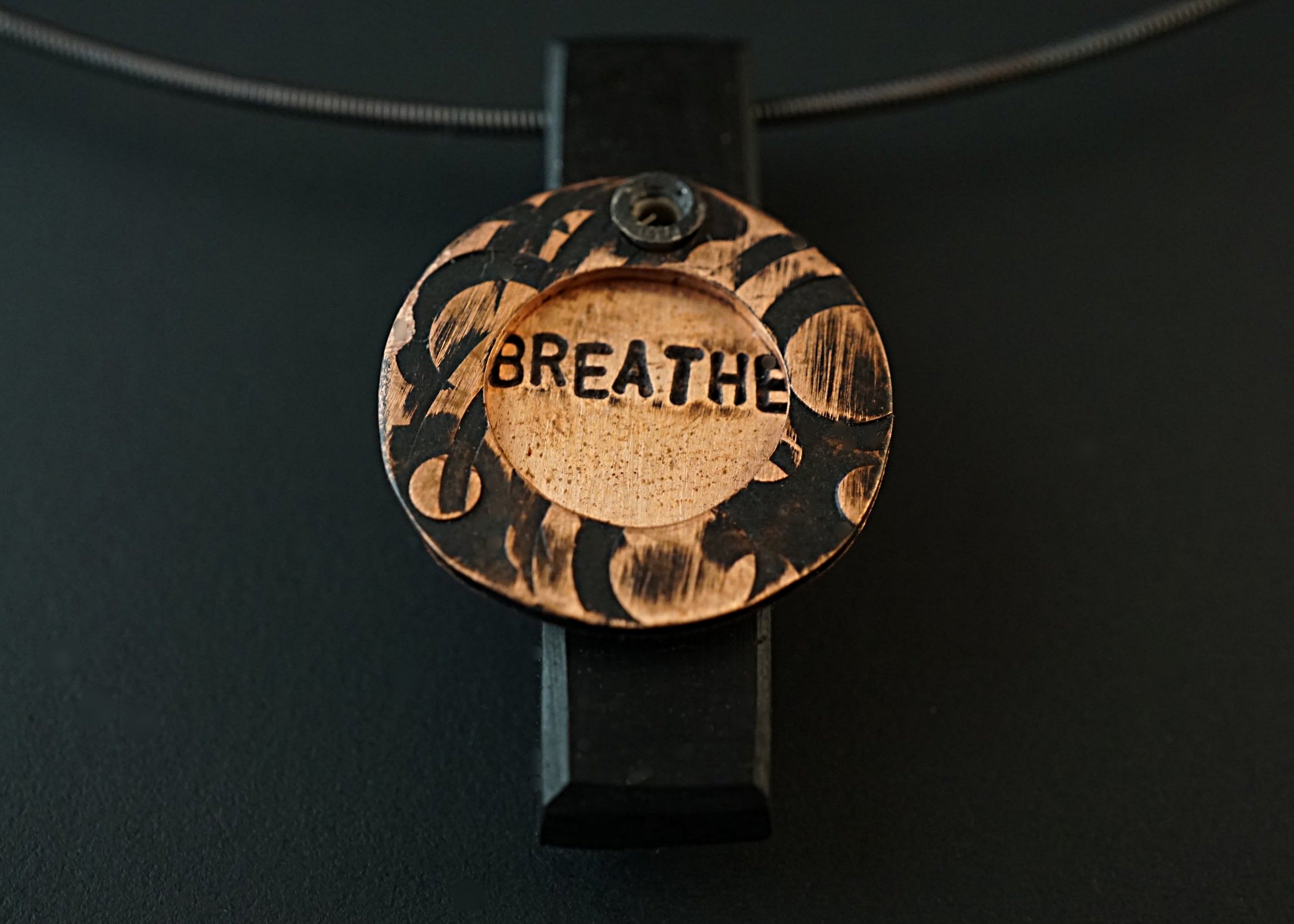Breathe pendant with copper stampings and ebony