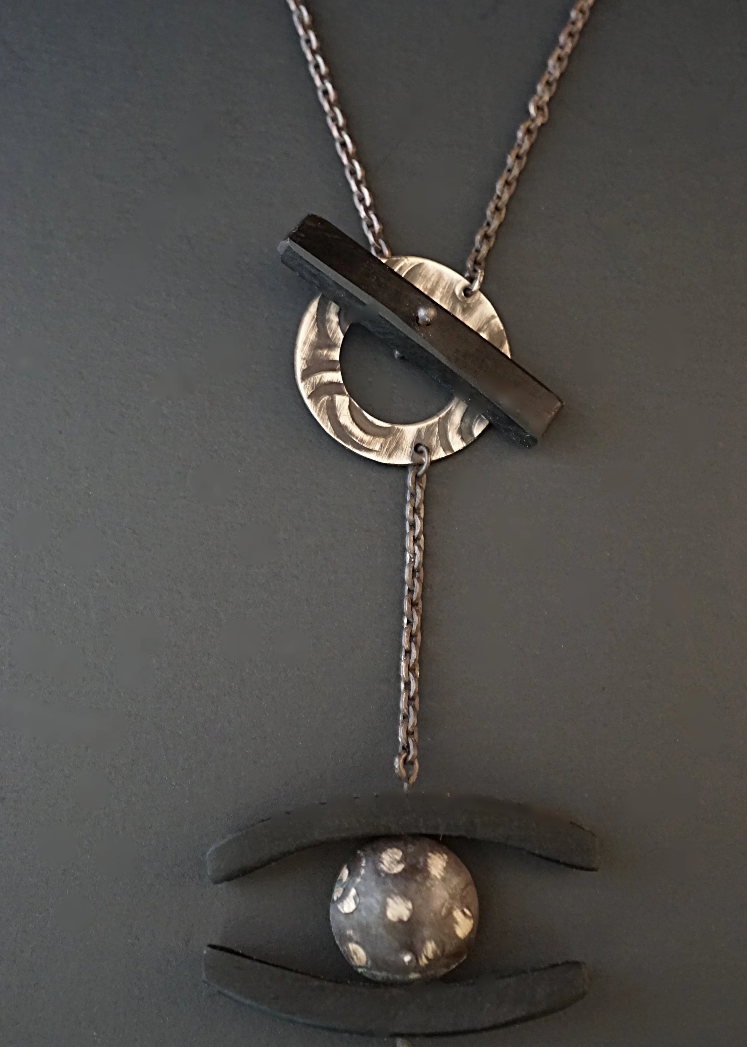 Ebony hand stamped domed sterling silver pendant