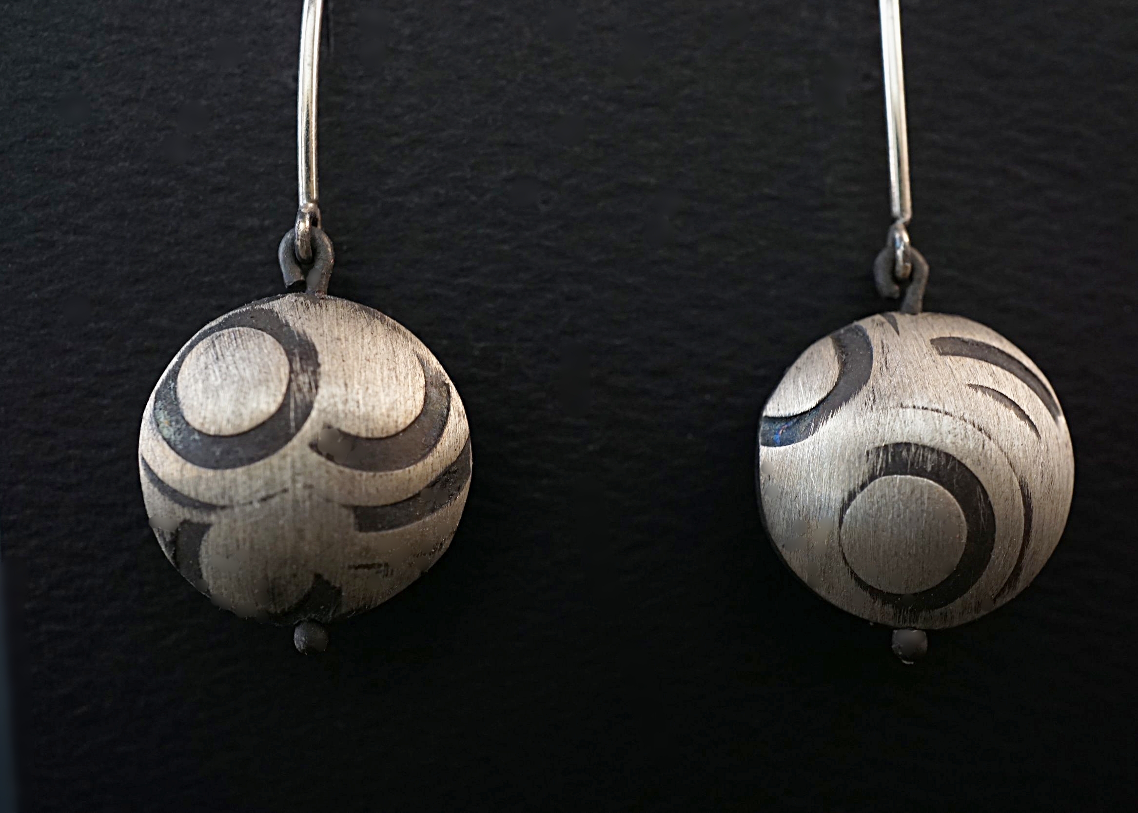 Hand stamped and domed sterling silver earrings