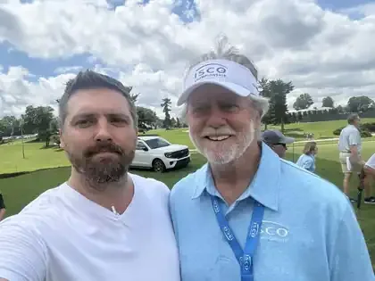 James Green with his father at a charity golf scramble