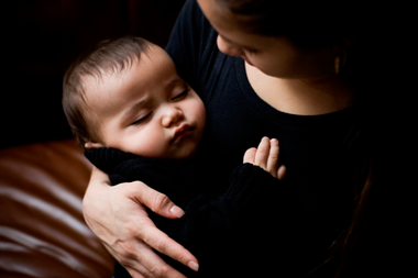 baby-sleeping-in-moms-arms.png