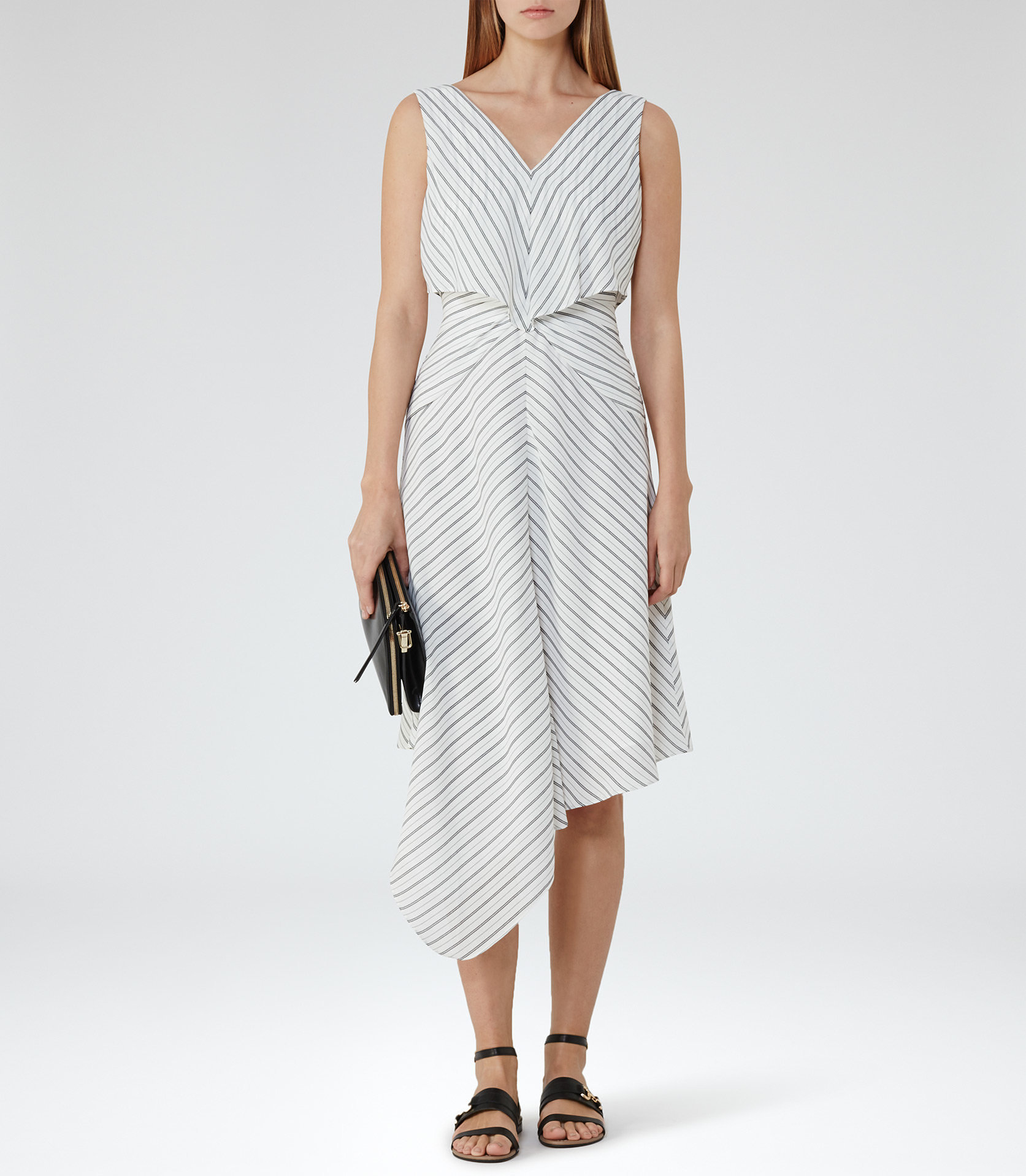 Reiss £180. Perfect for a city wedding, its styled casually here. Try teaming with this red KG sandal, an envelope clutch and a pair statement of earrings.