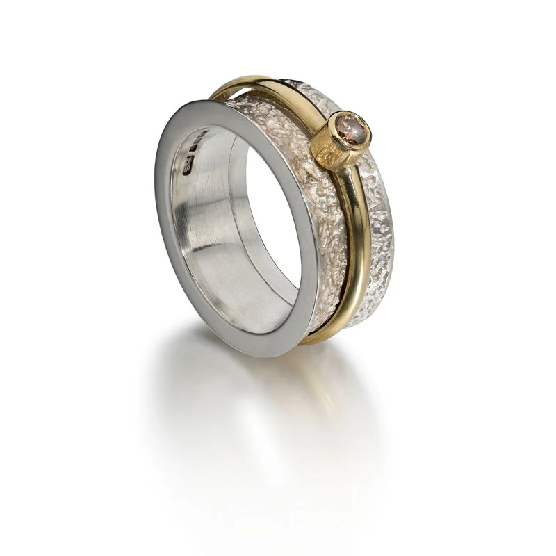 Etched silver opening ring and 18ct gold inner  ring with cognac diamond