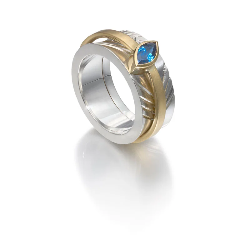 Engraved silver opening outer ring, 18ct gold inner ring with sapphire