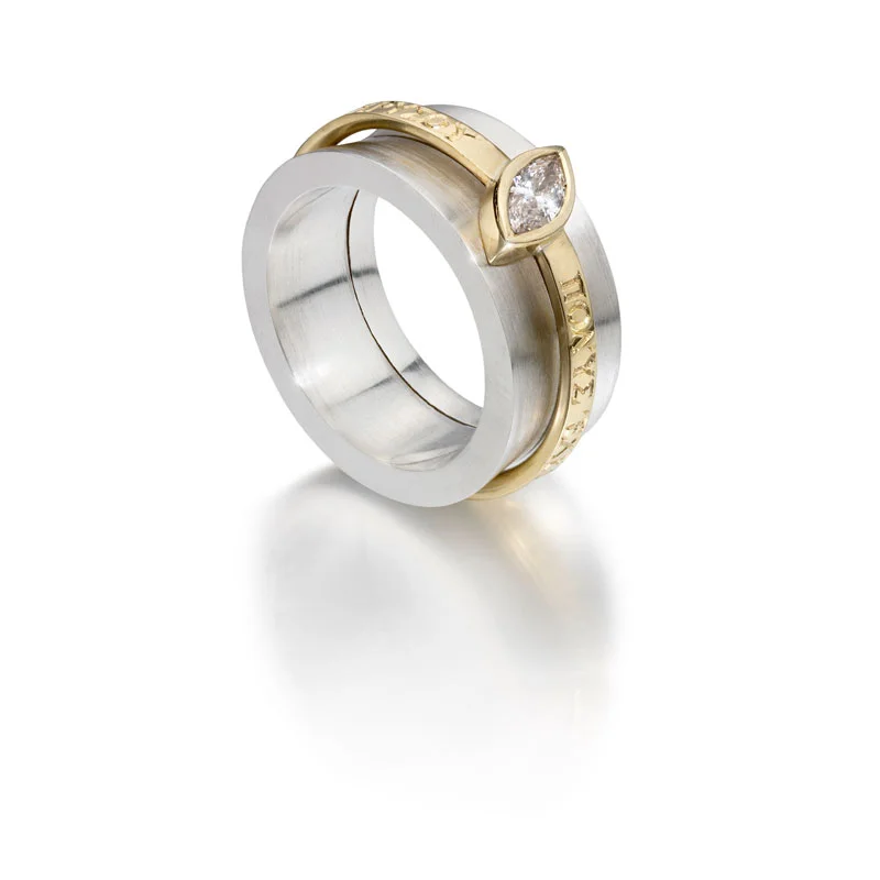 Etched silver opening outer ring and 18ct gold engraved diamond ring