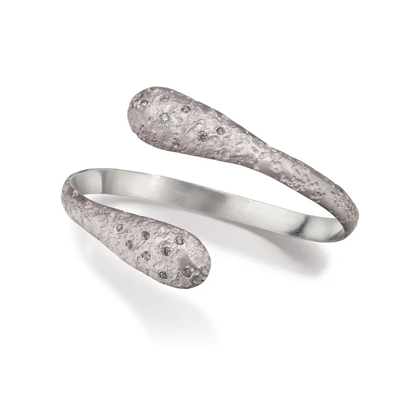 Silver and diamond teardrop bangle with diamonds