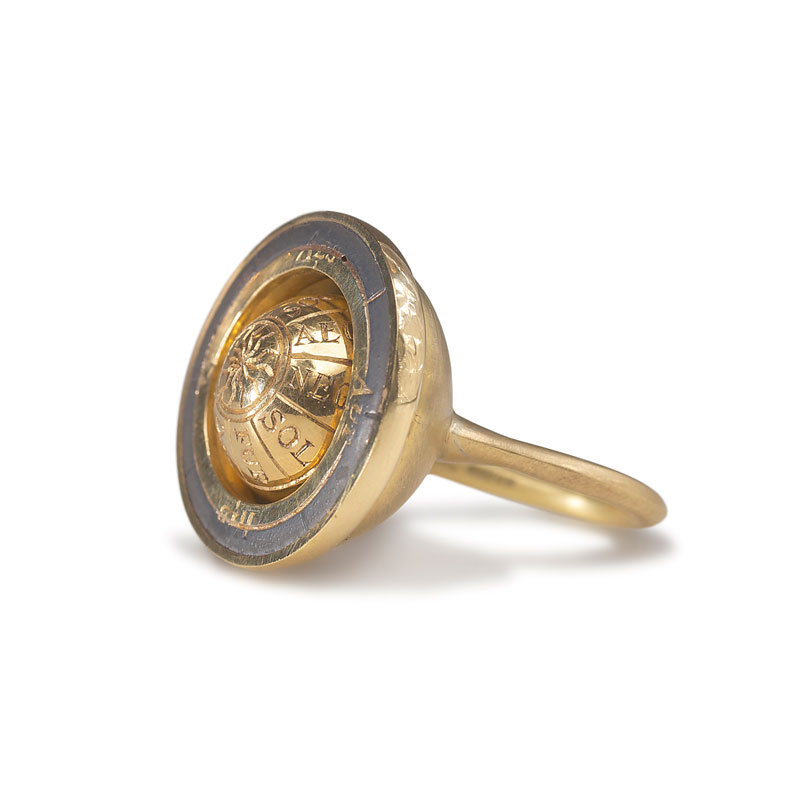 18ct gold engraved rotating armillary ring and oxidised silver 