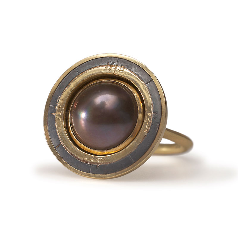 18ct gold engraved rotating armillaryring and oxidised silver