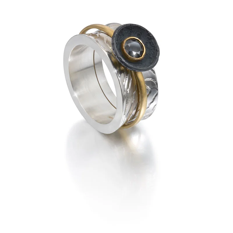 Engraved silver opening outer ring, 18ct gold inner ring with black diamond