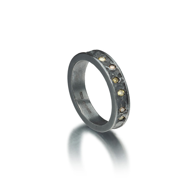 Black rhodium plated etched silver ring with diamonds
