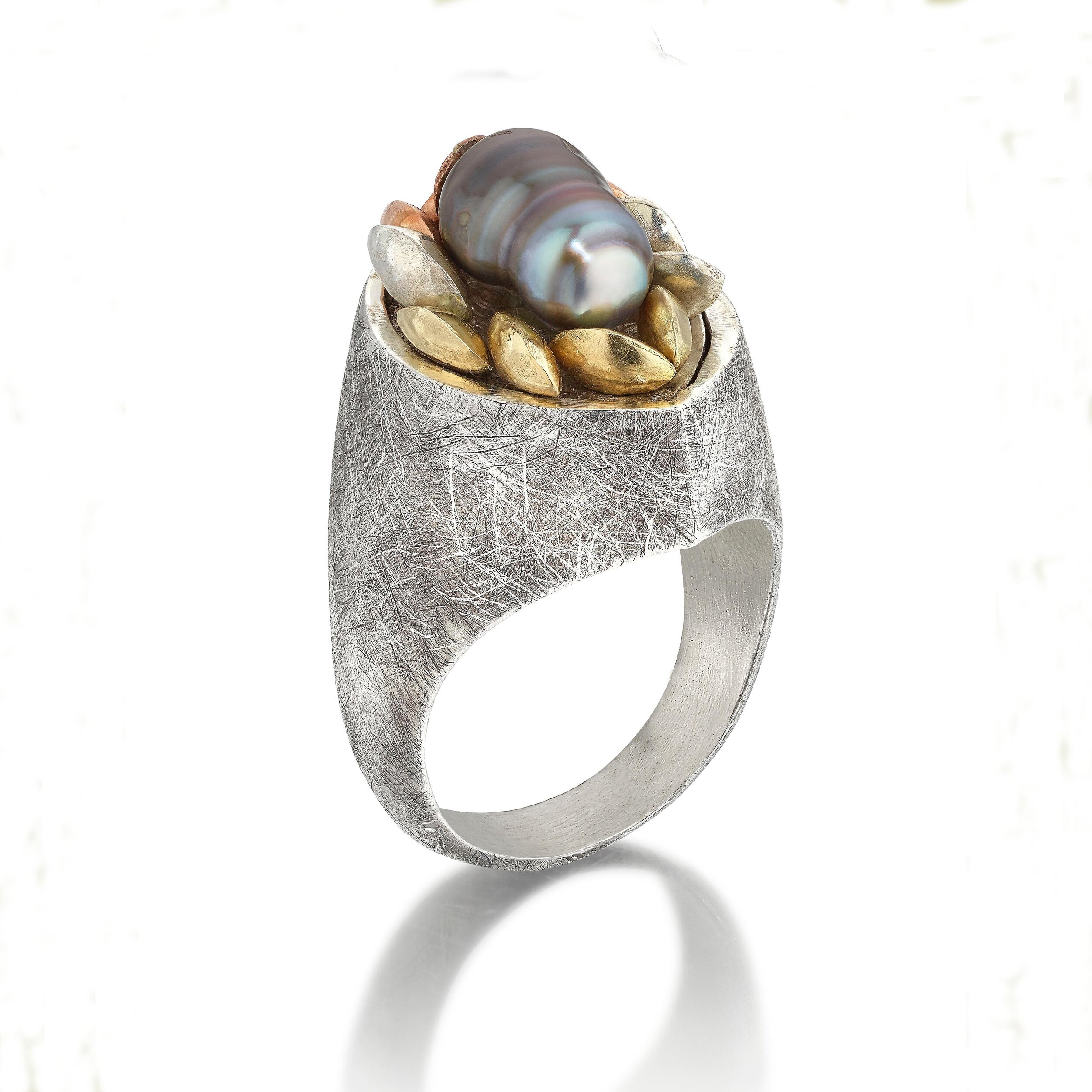 Gold and silver &rsquo;seeds&rsquo; which have a slight movement and snuggle around this gorgeous keshi pearl. This ring is part of my Acini collection whose signature style are articulated seeds.
.
.
#acinicollection #keshipearl #susihinesjewellery 