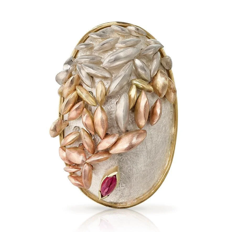 Acini brooch. Inspired by seed formation this can also be worn as a pendant with articulated silver and gold seeds and a ruby. 
See it @madelondonmarylebone at Stand21 with @findamaker Friday - Sunday 11-5 opposite Great Portland Street Station Ticke